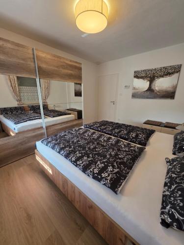 a bedroom with two beds in a room at Ferienwohnung Am Bärenstein, Fränkische Schweiz in Gößweinstein