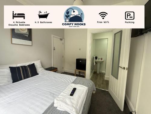 a bedroom with a bed and a sign for a bathroom at Charles Street House in Redcar