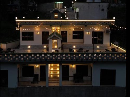 a house with lights on top of it at night at Escaven - Your escape to Heaven 