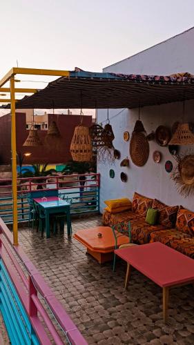 a living room with a couch and tables in a room at Riad SULTANA lateral seaview in Saidia 