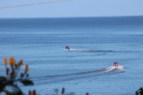 two people skiing in the ocean on the water at La Terraza Verde in Drake