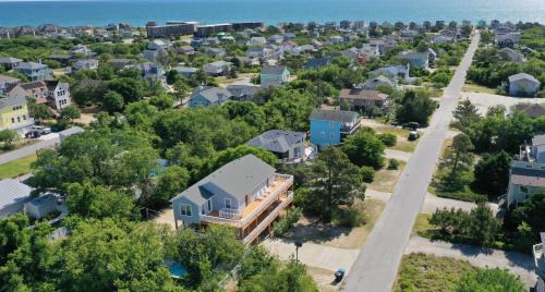 an aerial view of a residential neighborhood with houses at Follow the Sun in Duck