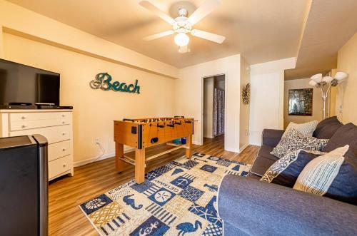 a living room with a couch and a table at Follow the Sun in Duck