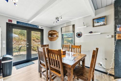 a dining room with a wooden table and chairs at Scenic Basecamp Retreat Near Trails and Town in Vail
