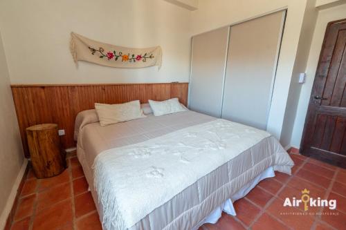 a bedroom with a bed in a room at Hotel FG Tafi in Tafí del Valle