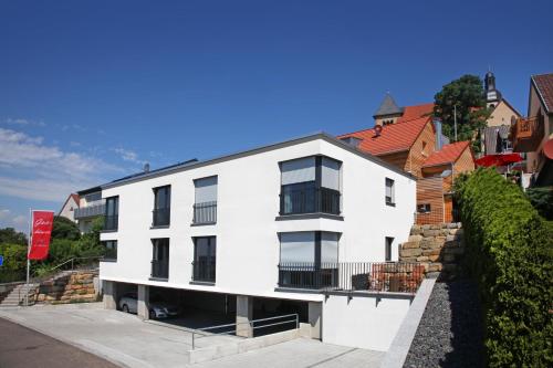 a white building with a red roof at AKZENT Hotel Altes Casino in Fulda