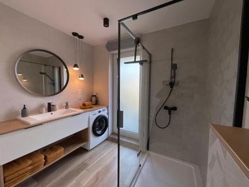 a bathroom with a sink and a washing machine at Weekend House Alsóörs in Alsóörs