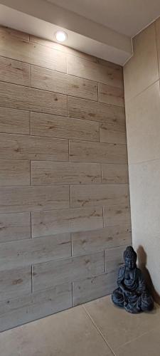 a corner of a room with a wooden wall at CaSa ViTo Kumrovec 
