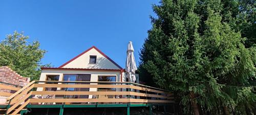 a building with a steeple and a church at CaSa ViTo Kumrovec 
