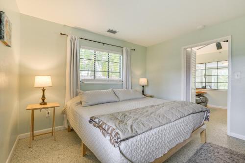a bedroom with a large bed and a window at 3 Mi to Dtwn Fort Myers Apt with Outdoor Space in Fort Myers