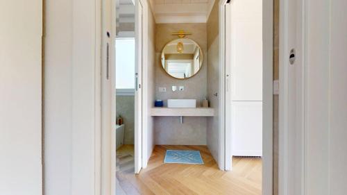 a bathroom with a sink and a mirror at Onnis Home Stay in Villasimius