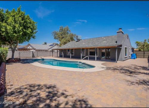 a house with a swimming pool in a yard at Phoenix Home - Oasis by the Hills in Phoenix