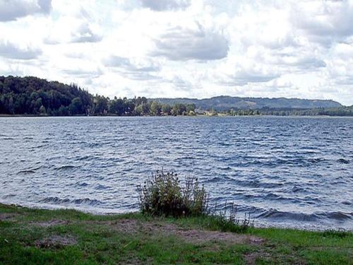 a large body of water with trees in the background at 4 person holiday home in Hampen in Hampen