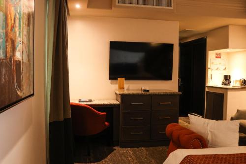 a hotel room with a flat screen tv on the wall at Hotel Ticuán in Tijuana