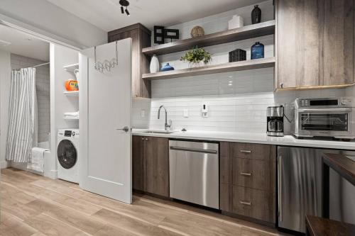 a kitchen with a sink and a microwave at Centrally Located Lake Oswego Studio in Lake Oswego