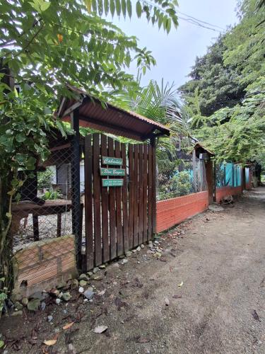 a wooden fence with a sign on it at BlueBayou.capurgana in Capurganá