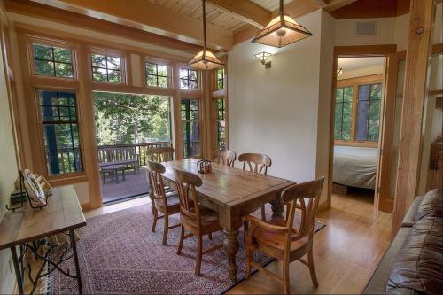 a dining room with a wooden table and chairs at COH1444 - Fallen Leaf Relief home in Fallen Leaf