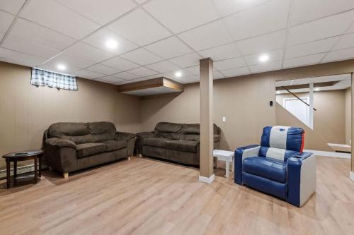 a living room with couches and chairs in a room at Lake Escape Family & Pet Friendly with Dock Access in Freedom