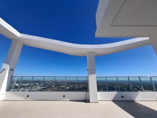 a view from the top of a building with a blue sky at Apartment Tower Luxury Home Palace a 100 mts Shopping del Sol con parking amplio in Asuncion