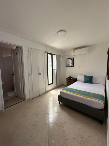 Ένα ή περισσότερα κρεβάτια σε δωμάτιο στο Hotel Lukas