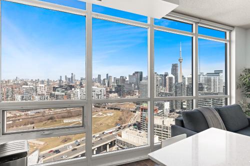 a living room with a view of a city at Apartment with Amazing Views, pool and free parking in Toronto