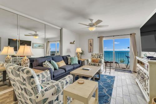 a living room with a couch and a table at Ocean House 1806 in Gulf Shores