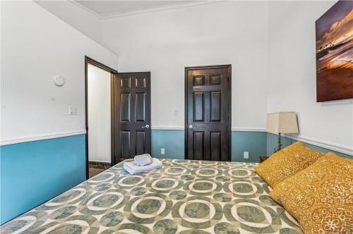 a bedroom with a large bed and two doors at Relaxing Family Retreat in the Heart of Sebastian home in Sebastian