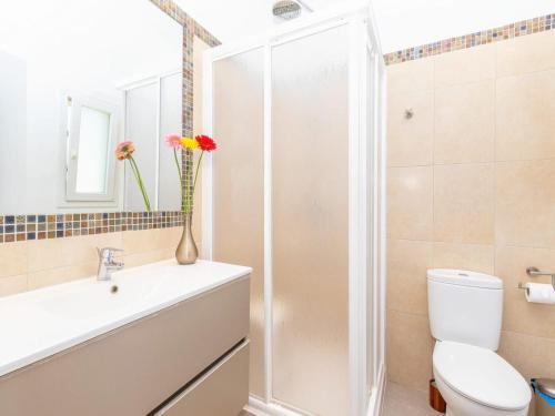 a bathroom with a shower and a toilet and a sink at Modern Villa with Pool in Cala d'Or in Cala D'or
