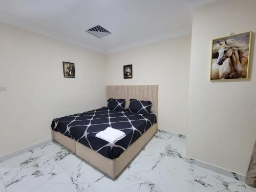 a bedroom with a bed with a marble floor at Everest vibes in Abu Dhabi