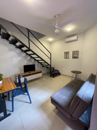 a living room with a couch and a staircase at CDE Duplex Rent - 3 Dormitorios in Ciudad del Este