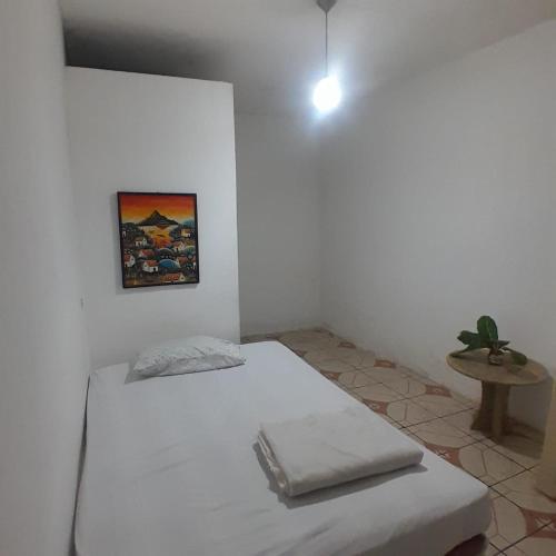 Una cama o camas en una habitación de Hostal Herrera