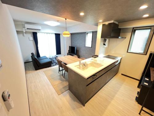 a kitchen and a living room with a dining room at ゼクス中浜 in Osaka