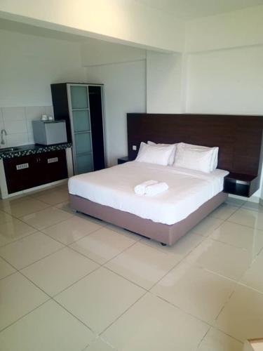 Ένα ή περισσότερα κρεβάτια σε δωμάτιο στο Marina sunset view