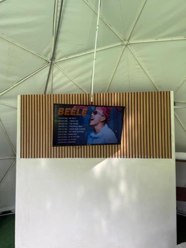 a poster on a wall in a tent at Glamping Lily in San Rafael