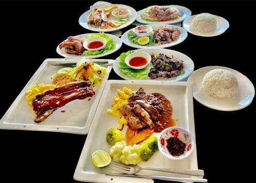 a group of plates of food on a table at SELA Bungalow and Italian Restaurant in Koh Rong