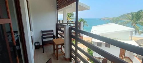 a balcony with a view of the ocean at Posada Ziga Playa in Mazunte