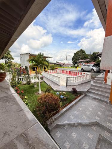 a view of a courtyard with red and white benches at Finca Villa Hermosa in Alcalá