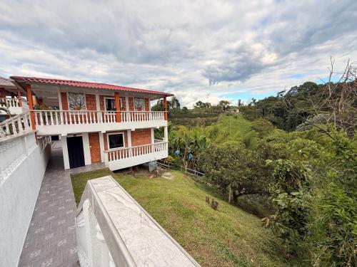an aerial view of a house with a balcony at Finca Villa Hermosa in Alcalá