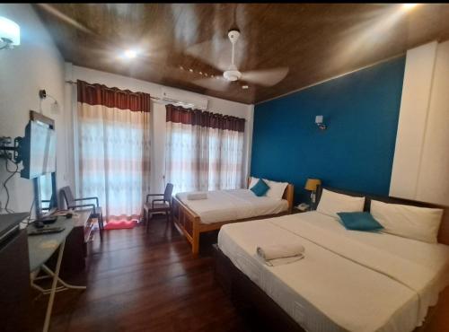 Ένα ή περισσότερα κρεβάτια σε δωμάτιο στο Lavendra Hotel