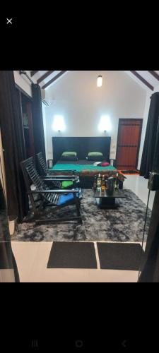 a living room with a couch and a table at Euro Elephant Yala in Tissamaharama