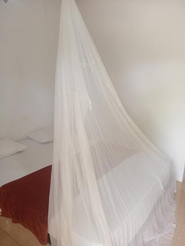 Ένα ή περισσότερα κρεβάτια σε δωμάτιο στο OPA OMA Homestay