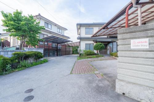 an empty parking lot in front of a building at 長野県上田市 最大15名 1棟貸し切り in Ueda