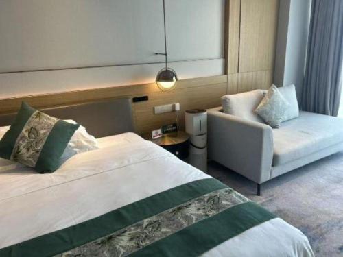 Zhangjiagang Guomao Hotelにあるベッド
