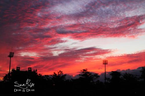 a sunset with red clouds in the sky at Yun Tien Feng Chuan B&B in Dongshan