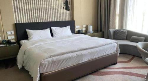Letto o letti in una camera di Urumqi Tianyuan Hotel