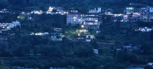 a view of a city at night at Hotel Namami Gange & Restaurant in Kedārnāth
