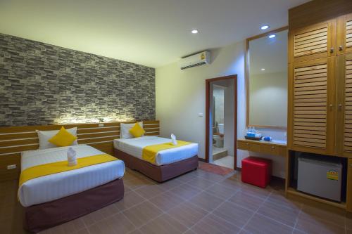 Katil atau katil-katil dalam bilik di Tee Pak Dee Resident Phuket