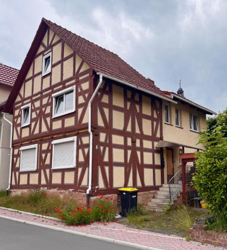 a half timberedbered house with a brown at Herberge Kleine Lea2 Gemeinschaftsbad KEIN WiFi in Richelsdorf