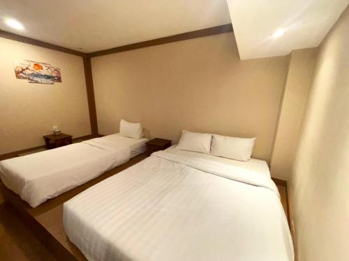 Letto o letti in una camera di The Ryokan Semarang
