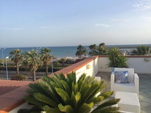 a view of the ocean from the balcony of a house at L'Approdo in San Leone